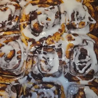 A tray of Holy Crumb glazed sourdough cinnamon buns.