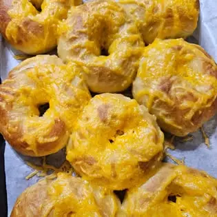 Holy Crumb cheddar-topped sourdough bagels.